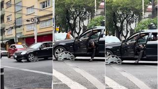 Reacción es épica: no se da cuenta que tenía la araña puesta y arrastra varios metros su coche [VIDEO]