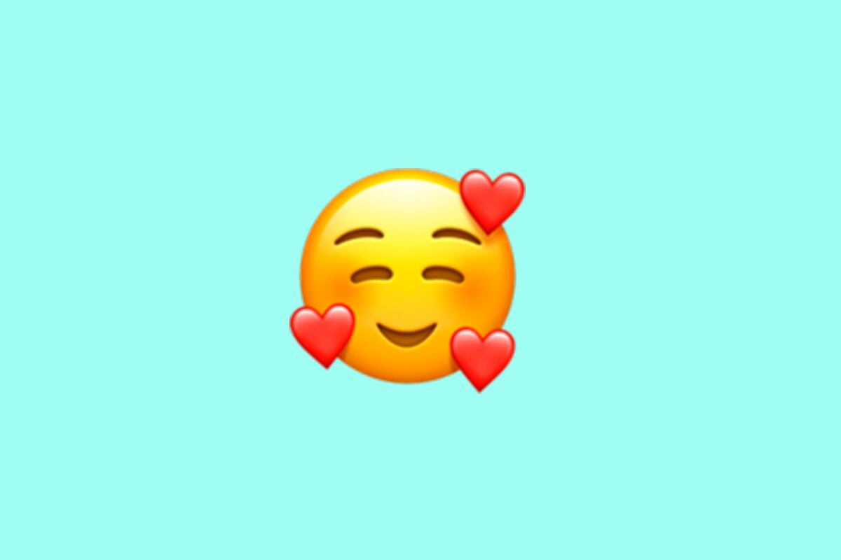 WhatsApp Qu significa el emoji de la carita rodeada de corazones