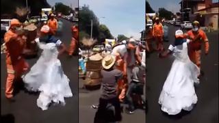 Trabajadores de limpieza encuentran un vestido y se pusieron a bailar un vals en plena calle