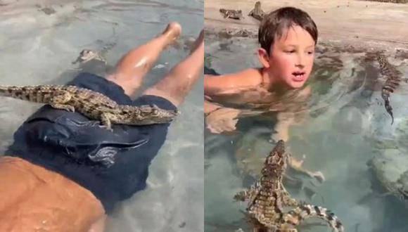 El niño no perdió la sonrisa en ningún momento mientras nadaba al lado de cocodrilos. (Foto: @ViralizandoAndo/Twitter)