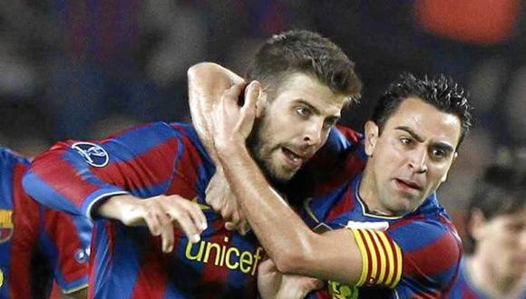 Xavi y Piqué fueron compañeros en el Barcelona entre el 2008 y 2015. (Foto: AFP)