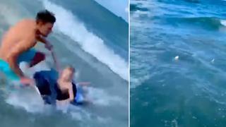 Un héroe: policía es captado salvando a un niño de ser devorado por tiburón