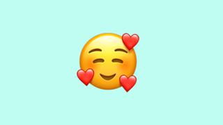 WhatsApp: qué significa el emoji de la cara rodeada de corazones