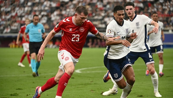 Denmark's midfielder #23 Pierre-Emile Hojbjerg and England's midfielder #10 Jude Bellingham fight for the ball during the UEFA Euro 2024 Group C football match between Denmark and England at the Frankfurt Arena in Frankfurt am Main on June 20, 2024. | Photo by Angelos Tzortzinis / AFP