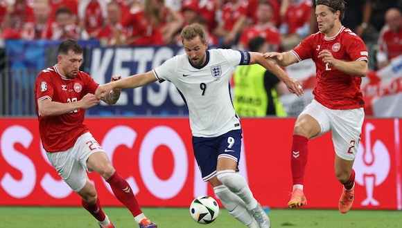 England's forward #09 Harry Kane (C), Denmark's midfielder #23 Pierre-Emile Hojbjerg and Denmark's defender #02 Joachim Andersen fight for the ball during the UEFA Euro 2024 Group C football match between Denmark and England at the Frankfurt Arena in Frankfurt am Main on June 20, 2024. | Photo by Adrian Dennis / AFP
