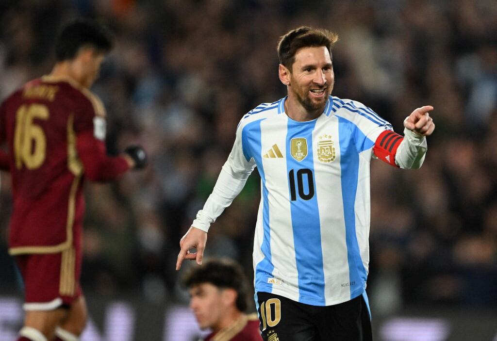 Argentina's forward #10 Lionel Messi celebrates after scoring his second goal during the 2026 FIFA World Cup South American qualifiers football match between Argentina and Venezuela at the Mas Monumental stadium in Buenos Aires on September 4, 2025. (Photo by Luis ROBAYO / AFP)