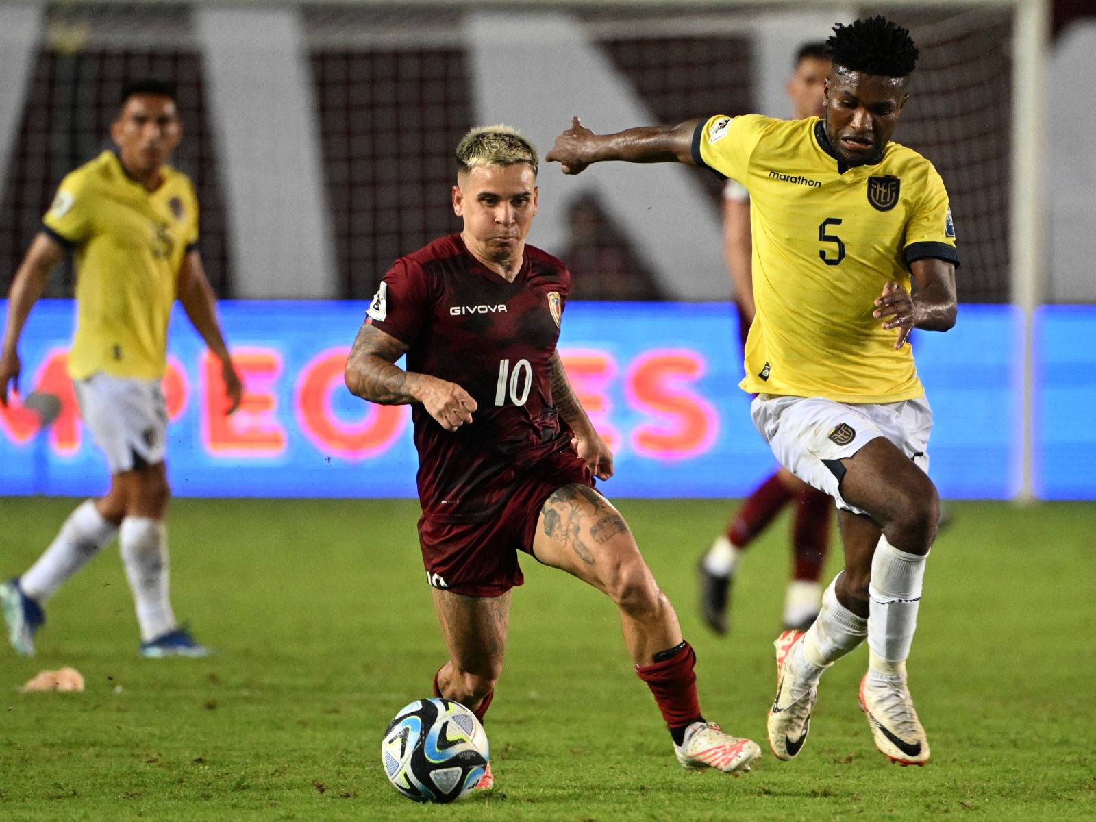 Venezuela's midfielder Yeferson Soteldo (L) and Ecuador's midfielder Jose Cifuentes fight for the ball during the 2026 FIFA World Cup South American qualification football match between Venezuela and Ecuador at the Monumental Stadium in Maturin, Venezuela, on November 16, 2023. | Photo by Federico Parra / AFP