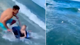 Un héroe: policía es captado salvando a un niño de ser devorado por tiburón